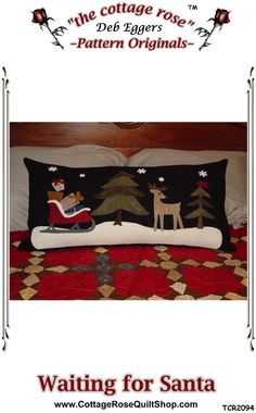 the bed is made with black and white quilts, which have reindeers on them