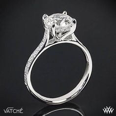 a white gold engagement ring with diamonds on it