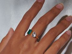 Meet your new favorite statement piece: our Toi et Moi Ring, showcasing a stunning duo of green onyx and white topaz. This chic, 14k gold-plated sterling silver ring is more than just a piece of jewelry - it's a symbol of unity and balance. The perfect blend of timeless elegance and modern style, it's sure to turn heads wherever you go. Green Onyx stone size: 6mm x 8mm; White topaz stone size: 6mm x 9mm. The band is made of 14k gold over sterling silver. Adjustable band between size 6-7.5. Hypoa Green Emerald Open Ring With Vs Clarity, Vs Clarity Open Emerald Ring, Topaz Cocktail Ring, Green Onyx Stone, Ring Sale, Topaz Stone, Onyx Stone, Green Onyx, Gold Filled Jewelry