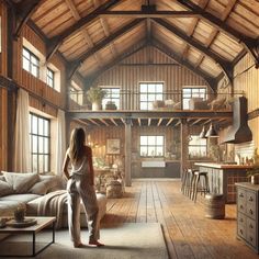 a woman standing in the middle of a living room with wooden floors and walls, looking out onto an open floor plan