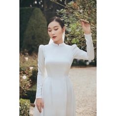 Traditional White Ao Dai For Formal Occasions, Traditional Fitted White Wedding Dress, Fitted White Ao Dai For Ceremonies, Traditional White Ao Dai For Wedding, Elegant White Ao Dai For Formal Occasions, White Fitted Ao Dai For Wedding, Traditional Fitted White Ao Dai, White Long Sleeve Ao Dai, Traditional White Long Sleeve Ao Dai