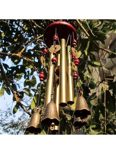 bells hanging from the side of a tree