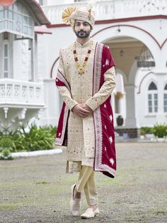 Golden colour Designer Sherwani for groom made from the finest fabric embellished with fine thread,zari & stone work paired with a matching pajama & a maroon stole/shwal complimenting the lehanga color of the bride.We can customize it according to your measurement as the fitting make it more beautiful to wear.Groom dresses,wedding Dresses For men COST INCLUDES SHERWANI,PYJAMA & STOLE/SHWAL TO BUY MACHING ACCESSORIES LIKE JUTIYA ,TURBAN ETC. PLZ CONTACT US Traditional Drape Naqshi Churidar For Wedding, Naqshi Churidar With Traditional Drape For Wedding, Traditional Naqshi Churidar For Wedding, Traditional Naqshi Sherwani For Wedding, Bollywood Style Sherwani With Pallu For Traditional Ceremonies, Traditional Wedding Sherwani With Naqshi, Ceremonial Long Sherwani With Dupatta, Traditional Groom Sherwani With Naqshi, Traditional Groom's Sherwani With Resham Embroidery