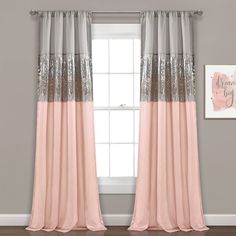 pink and gray curtains with sequins on the top are hanging in front of a window