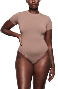 This fitted crewneck bodysuit from Kim Kardashian West's SKIMS gives the look of a tucked-in tee—making it perfect for everyday wear. The breathable stretch jersey hugs your curves while keeping you comfortable, so you can wear it as a base layer or alone. Snap closure Crewneck Short sleeves 90% cotton, 10% elastane Machine wash, tumble dry Imported Women's Clothing Shirt Making, Seductive Clothes, Base Layer, Jersey T Shirt, Kim Kardashian, Stretch Cotton, Snap Closure, Clothing Items, Everyday Wear