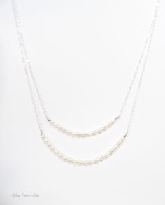 "Freshwater Pearl Strand Necklace ~ Available in 100% Sterling Silver, 14k Gold Fill or Rose Gold Fill Capture the beauty of nature with strands of genuine freshwater rice pearls - Perfect for the bride or bridesmaids gifts! - Genuine freshwater rice pearls in a beautiful white / ivory - Lengths are show at 17\" & 19\"- Measure and choose your favorite length - Chain is a sparkly sterling silver or 14k gold fill, or rose gold fill chain - Necklace closes with a 14k gold fill, rose gold fill Silver Double Strand Necklace For Wedding, White Double Strand Pearl Necklace For Wedding, Double Strand Pearl Drop Jewelry For Wedding, Delicate Double Strand Necklace For Wedding, Double Strand Pearl Drop Necklace For Weddings, Double Strand Pearl Chain Jewelry For Weddings, Double Strand Pearl Chain For Wedding, Single Strand Sterling Silver Necklace For Wedding, Silver Double Strand Pearl Necklace For Anniversary