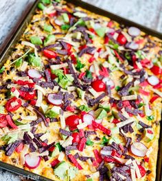 a pizza topped with lots of veggies and cheese