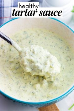 a bowl filled with broccoli and cream sauce