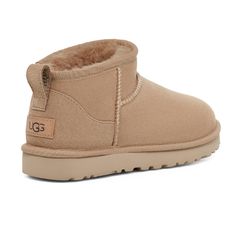 UGG Women's Classic Ultra Mini Sand 1116109-SAN The Classic Ultra Mini updates UGG's most iconic silhouette with a lower shaft height, adding easy on-off and enhanced versatility. Pre-treated to keep it looking better for longer, this Classic features everything you love about the original, like signature UGG sheepskin and a flexible, ultra-lightweight sole. Wear with virtually anything – the styling options are endless. These provide comfort for people who suffer from bunions, plantar fasciitis Ultra Mini Uggs, Classic Boots Woman, Mini Uggs, Sand Boots, Ugg Classic Ultra Mini, Jerome Dreyfuss