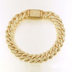 This stunning 12mm width solid men's Cuban chain bracelet features 6.50 carats diamonds professionally set pave on every link. The three diamonds flow beautifully throughout the links and hidden clasp and sparkle from every angle. Customize your bracelet and make it your own. Metal : 14K Solid Gold Approx. Weight : 40 Grams Setting Type : Pave Width : 12 mm Length : 8", 8.5", 9" Total Carat : 6.50 Carats Type : Natural Diamonds Shape : Round Cut Carat Weight : 6.50 Ct. Cut : Excellent Color : G- Trap Style, Cuban Chain Bracelet, Display Counter, Fashion Accessories Trends, Chain Diamond, Ideas Jewelry, Gold Wedding Jewelry, Jewelry Statement, Cross Bracelet