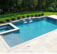 an empty swimming pool in the middle of a yard