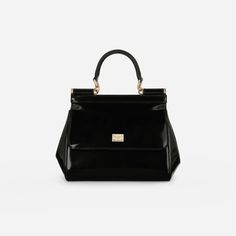 Elevate your style with the Sicily Medium Handbag in Glossy Black/Gold. Crafted from polished calfskin, this iconic bag exudes understated femininity. Complete with a logo tag featuring two metal plating finishes, it's perfect for any occasion. Make a statement with this luxurious and versatile handbag. Dolce And Gabbana Handbags, Medium Handbags, Backpack Travel Bag, Iconic Bags, Logo Tag, Mini Wallet, Wallet Bag, A Logo, Phone Bag