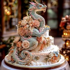 a cake decorated with flowers and a dragon on top