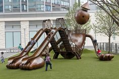 children are playing on the playground equipment