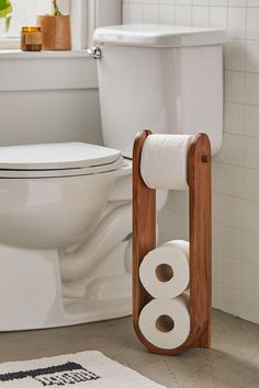 a toilet with two rolls of toilet paper on it