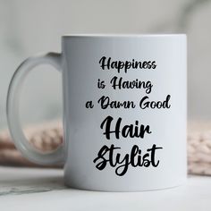 a white coffee mug with the words happiness is having a damn good hair stylist