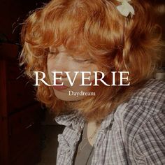 a woman with red hair is wearing a plaid shirt and has the words reverie on it