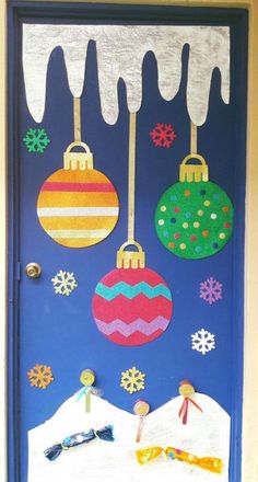 a door decorated with christmas ornaments and snow