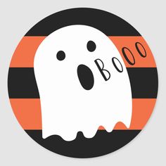 a round sticker with a ghost on it's face and the word boo spelled in