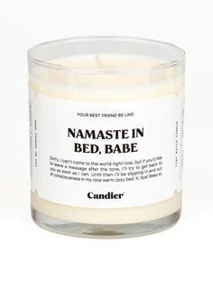 a candle that says namastein bed, babe on the front and back of it