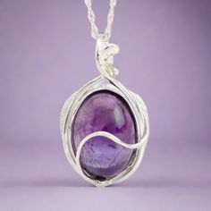 This "Murazaki" pendant necklace is handmade of 999 fine silver. It has been hand crafted in pure 99.9% solid silver in my workshop. It features a translucent Amethyst gemstone. "Murazaki" means "purple" in japanese. NOTE: This piece of jewelry has been created around this one-of-kind gemstone. It is unique and cannot be reproduced. Only one available! Amethyst Silver Jewelry With Polished Finish, Silver Wire Wrapped Necklaces, Purple Necklace With Polished Finish As Gift, Amethyst Necklace With Large Pendant For Healing, Handmade Oval White Gold Necklace, Purple Sterling Silver Spiritual Necklaces, Amethyst Large Pendant Necklaces For Jewelry Making, Purple Sterling Silver Necklace With Large Pendant, Purple Sterling Silver Necklace With Polished Finish