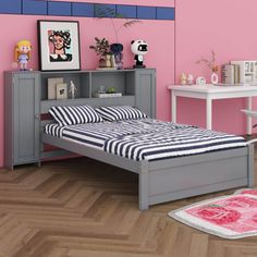 a bedroom with pink walls and wooden floors