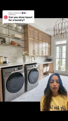 a woman is standing in front of the washer and dryer with her mouth open