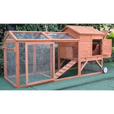 a large wooden chicken coop with stairs