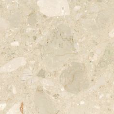 a close up view of a marble floor with white and brown colors on the surface