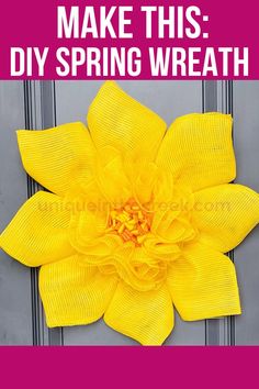 a yellow flower with the words make this diy spring wreath on it's front door