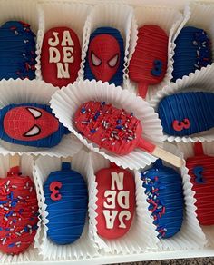 spiderman cupcakes are decorated with red, white and blue icing