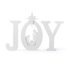 the word joy is made out of white plastic and has a nativity scene on it