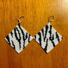 Hand Woven Zebra Print Earrings By Indigenous Artist. Size 12 Seed Beads Stitched Together. Gold Plated Lever Back Hooks. Loom Designs, Stitched Together, Bead Loom Designs, Seed Beading, Bead Loom, Bead Stitching, Beaded Animals, Beading Projects, Animal Prints