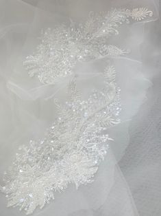 Light Ivory Wedding Lace Applique/Floral Bridal Lace Applique/Pearls Beaded Lace Applique/Top Quality, Sell By Mirror Pair Sell by pairs, please select the quantity you need. Stock Color Light Ivory  Material Rayon, clear sequins，plastic pearls, beads and net Measurements About   This is a very stunning beaded lace pair, very shinning under the light or sunshine. Beaded Pearl Bridal Accessories For Wedding, Wedding Pearl Beaded Bridal Belt, Wedding Bridal Belt Beaded With Pearls, Wedding Bridal Belt With Beaded Pearls, White Rhinestone Bridal Accessories For Ceremony, White Bridal Accessories With Rhinestones For Ceremony, Pearl White Pearl Bridal Accessories, Pearl White Bridal Pearl Accessories For Wedding, Embellished Tulle Wedding Dress