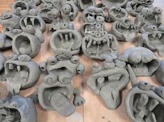 there are many clay sculptures on the floor