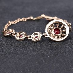 Turkish jewelry red stone charm bangle with crystal insert accents in ancient gold color. An old world design that adds character and flair to any outfit. Details Item Type: Fashion Bracelets Metal Type: Copper,Brass Plating: Gold Material: Resin,Crystal Length: 17.5+6.5cm Rose Gold Alloy Bracelets, Alloy Jubilee Bracelet As Gift, Jubilee Bracelet Made Of Alloy As A Gift, Red Alloy Jewelry As A Gift, Elegant Red Chain Bracelet For Gift, Red Metal Chain Bracelet For Gift, Red Metal Chain Bracelet Gift, Red Metal Crystal Bracelet Gift, Alloy Jewelry Bracelet Strap As Gift