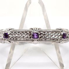 This Beautiful Judith Ripka Bracelet Features Three Square, Checkerboard Cut, Bezel Set Amethyst Stones. Floral Details 1.25" Opening 2.5" Diameter .5" Wide Medium Weight Hallmarked Professionally Cleaned Eb7536 Eaax Sterling Silver Amethyst Bracelet For Formal Occasions, Formal Sterling Silver Amethyst Bracelet, Elegant Silver Cuff Bracelet With Gemstone Accents, Elegant Purple Sterling Silver Bracelet, Elegant Sterling Silver Amethyst Bracelet, Elegant Sterling Silver Amethyst Bracelet For Formal Occasions, Elegant Purple Sterling Silver Bracelet For Formal Occasions, Elegant Formal Purple Sterling Silver Bracelet, Elegant Silver Amethyst Cuff Bracelet