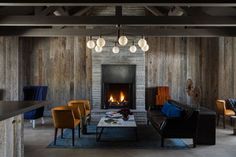 a living room filled with furniture and a fire place