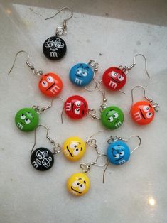 a bunch of different colored balls with faces on them