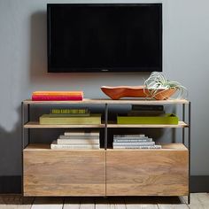 an advertisement for the industrial modular media console from west elm, which is on sale