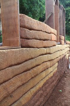 several stacks of wood are stacked on top of each other