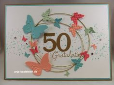 a birthday card with butterflies and the number 50 in it's center, surrounded by confetti