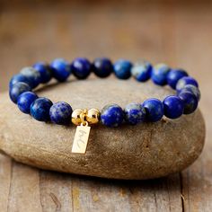 The Handmade Natural Lapis Lazuli Beaded Bracelet with a Gold Plated Tag looks great. It will make the perfect gift 🎁 for someone special, or treat yourself as you deserve it 💖 🥰 These Bracelets have been made using high quality Natural Lapis Lazuli and have a Gold Plated Tag with MC for MantraChakra. They are available as 4mm, 6mm and 8mm. Lapis Lazuli brings out your inner priestess, heightens inner-vison and deepens wisdom. It benefits the Throat Chakra with communication and expression of Gift Lapis Lazuli Beaded Bracelets With Polished Beads, Lapis Lazuli Beaded Bracelet Gift, Lapis Lazuli Gemstone Beads Bracelet For Gift, Lapis Lazuli Gemstone Beaded Bracelet For Gifts, Lapis Lazuli Beaded Bracelets As Gift, Polished Beads Charm Bracelet As Gift, Gift Lapis Lazuli Round Bead Bracelets, Gift Lapis Lazuli Bracelets With Round Beads, Lapis Lazuli Bead Bracelet Gift