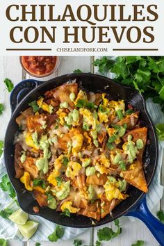 a skillet filled with nachos and guacamole on the side