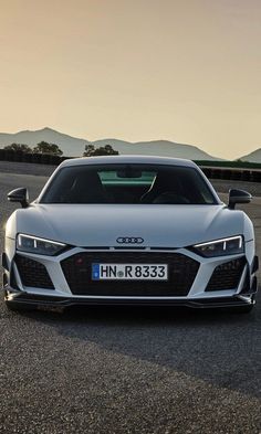 an audi sports car is parked on the road