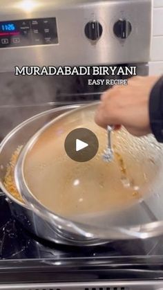 a person stirring food in a pan on top of an oven with the words murdababi biriyani easy recipe