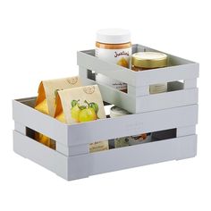 two white boxes filled with food and condiments