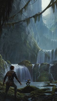 a man standing in the middle of a forest next to a waterfall