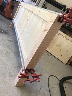 a piece of wood being worked on with tools