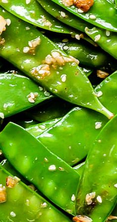 green beans with sesame seeds and seasoning on them